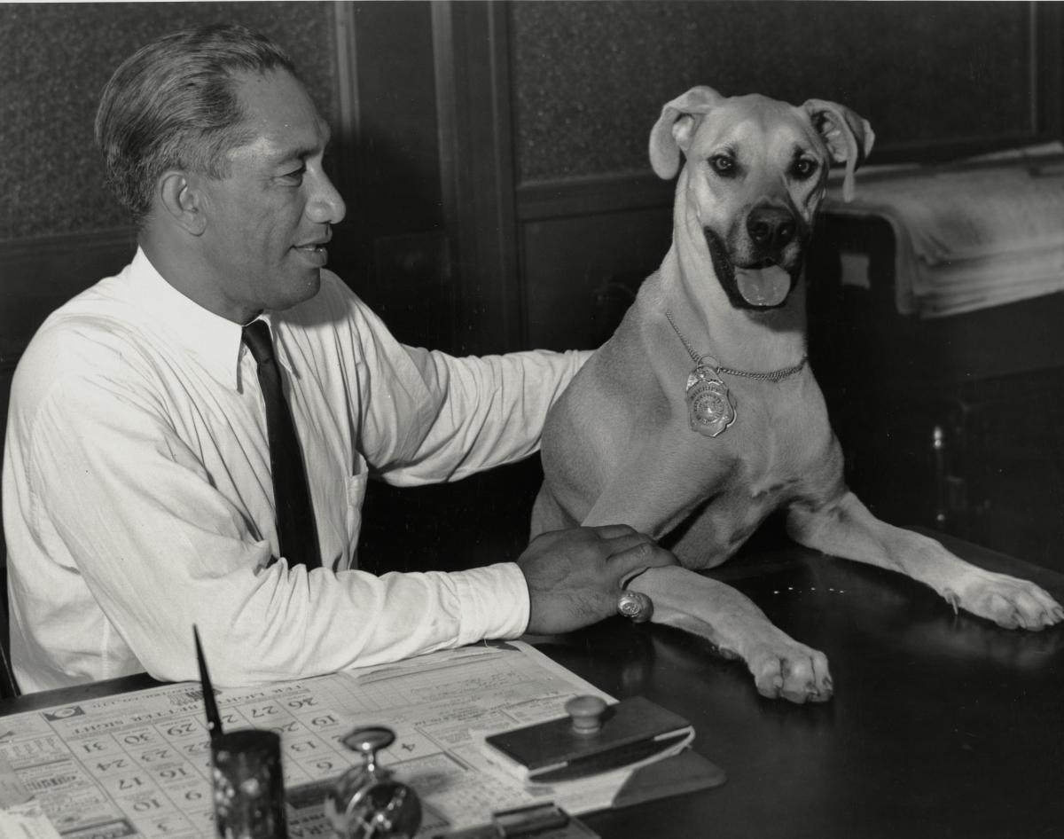 Duke Paoa Kahanamoku when he was sheriff with his dog, Duchess.