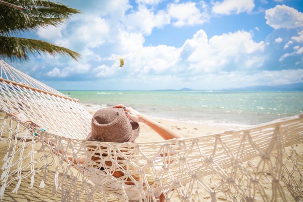 Woman On Hammock. Lifestyle Concept. Summer Vacation. Nature Concept. Summer Tourism, Travel.