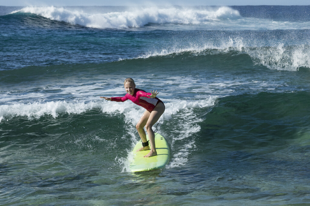 Young Girl Surfing, Kauai, Hawaii